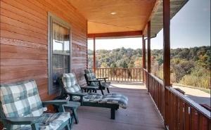 Covered porch with seating overlooking the valley