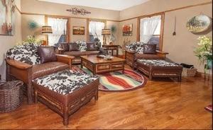 Open-concept living room inside the Bad Habit Lodge